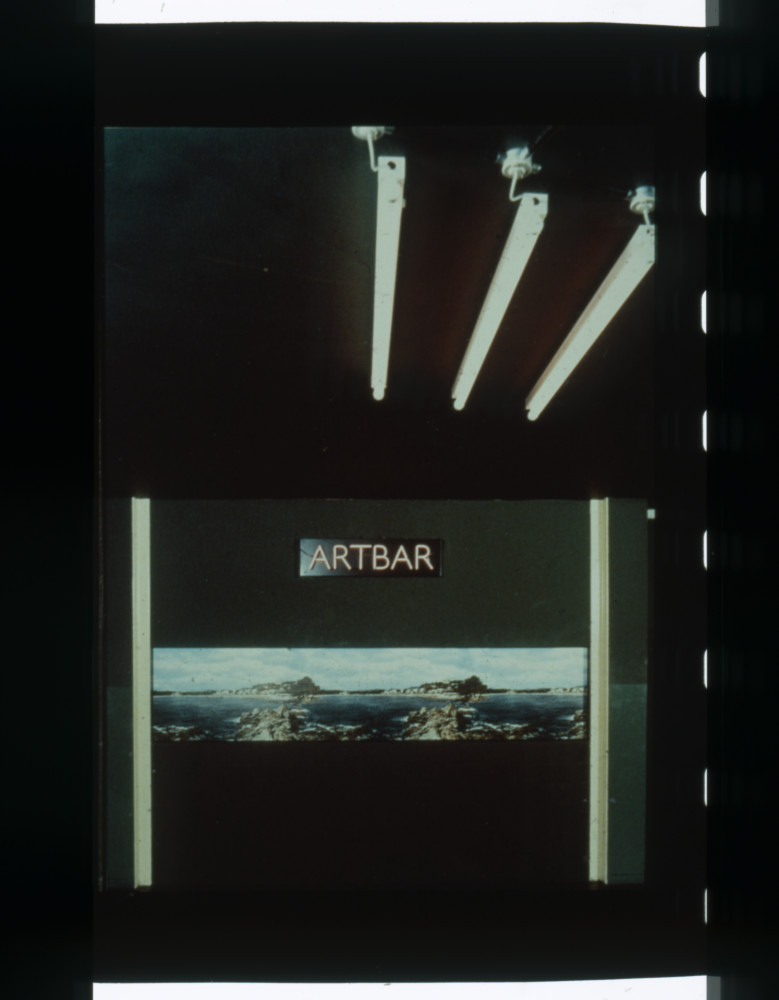 image of the original 1973 ArtBar, with original neon sign and black background